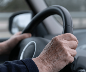elderly person driving